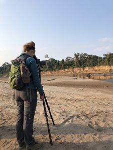 Traveler watching macaws near the Chuncho Clay Lick
